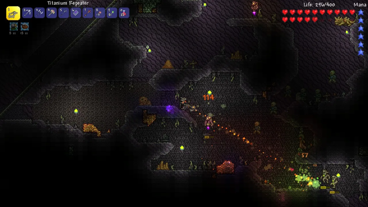 Official Terraria screenshot of a dark cave interior lit by torches