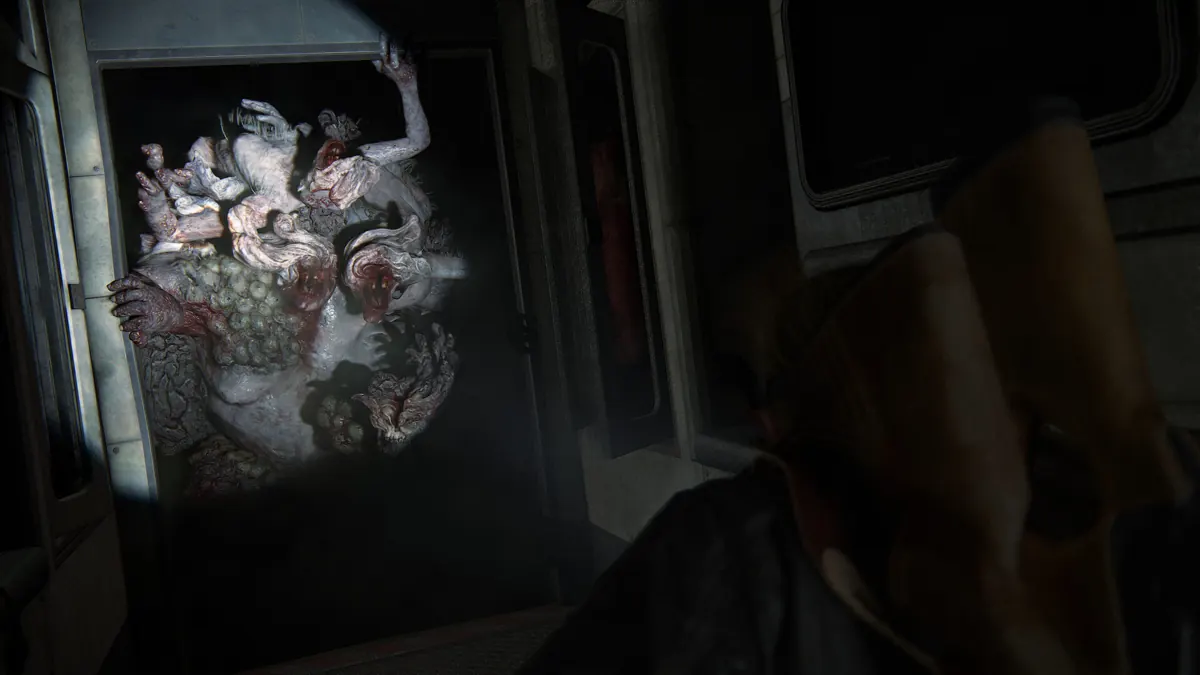 A dark interior scene from The Last of Us Part II Remastered
